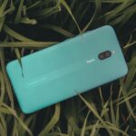 Free photo of close up of redmi cellphone