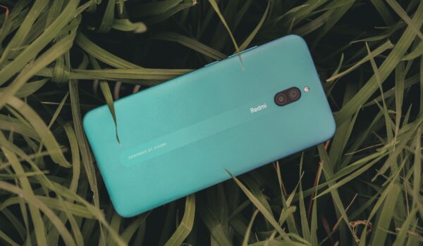Free photo of close up of redmi cellphone