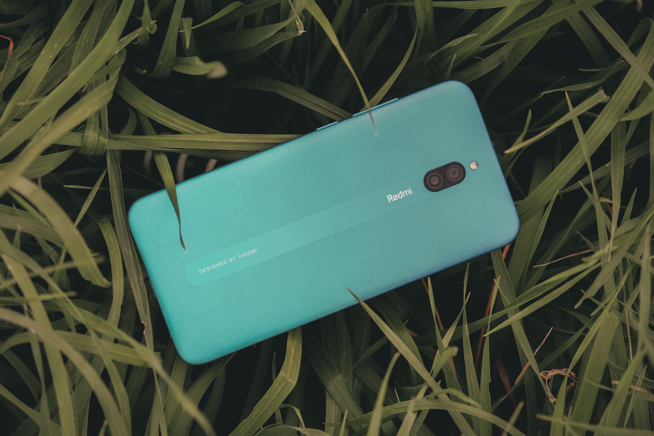 Free photo of close up of redmi cellphone